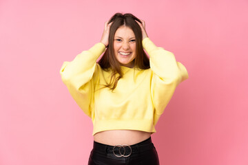 Teenager caucasian girl isolated on pink background doing nervous gesture