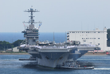 US Navy aircraft carrier George Washington arrives at Yokosuka Port in Japan.