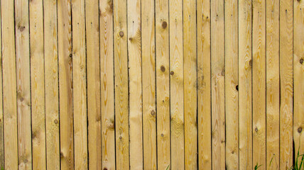 Wooden fence made of thin wood. Background
