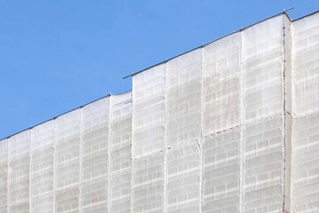 Plastic cloth covering tall buildings during construction