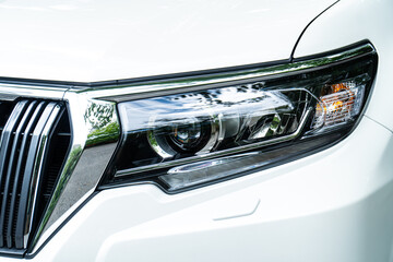 Car headlights. Exterior closeup detail.