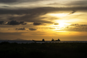 Sunset Background with ships silhouette