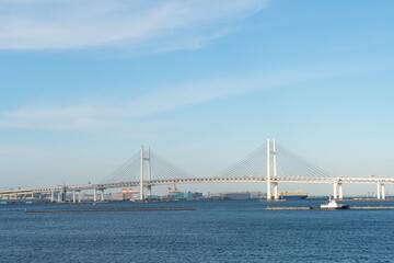 Exterior architecture and view of Yokohama bridge and Yokohama bay on the blue sky day. Yokohama is one of tourist destination place in visiting Japan and landmark for business and industrial in Kanto