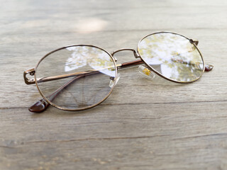 Eyeglasses on old wooden table