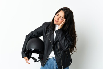 Woman holding a motorcycle helmet isolated on white background with headache