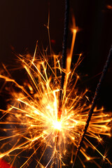 Close up of burning sparkler effect
