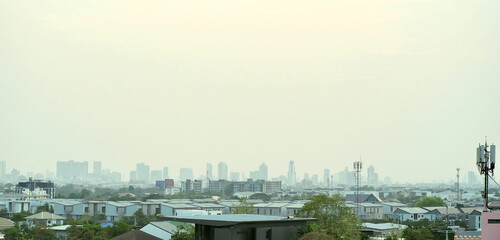 Fototapeta premium A panoramic view of the city covered with pm2.5 dust in the evening.