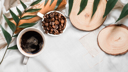 closeup black coffee cup put on linen fabric. top view