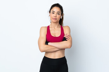 Fototapeta na wymiar Sport woman over isolated white background with arms crossed