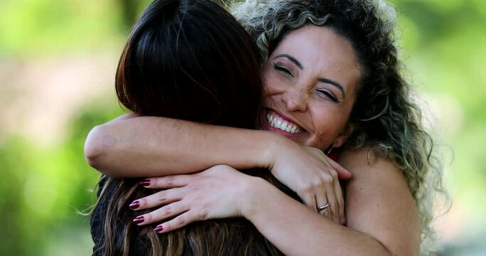 Two female friends hugging each other