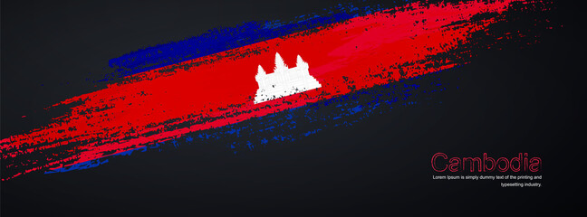 Grunge brush of Cambodia flag on shiny black background. Creative glitter sparkle brush paint vector illustration
