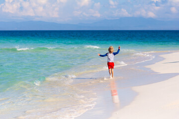 Kids playing on beach. Children play at sea.