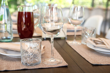 Empty wine glasses are on the table. A fragment of the serving.