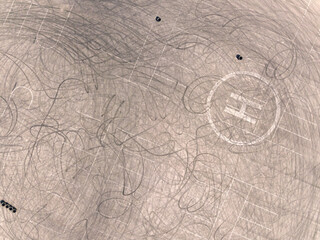 Aerial top down drone shot. Parking with tire tracks. Drifting location. Rostov region. Russia.