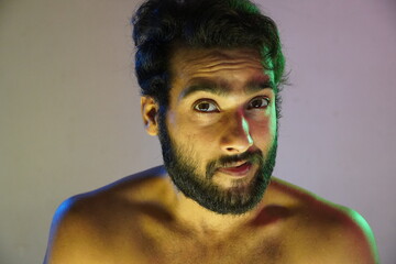 Obraz premium blue and green lightning on face Portrait of a man in studio