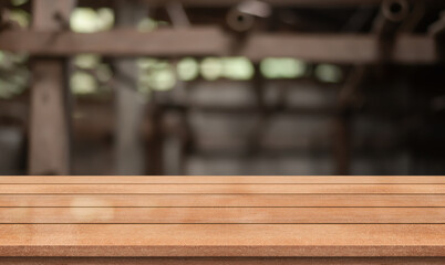 Empty wooden table top with lights bokeh on blur restaurant background.