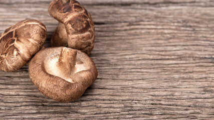 Shiitake mushrooms on the wooden background..Shiitake mushroom on wooden table.