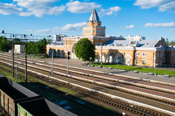 Ukraine, Chernigov May 21, 2021: Chernihiv railway station, top view, building, peron wagons and people in the distance. Limited travel during covid quarantine 19.