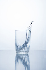 Alcoholic drink or water in a glass, splash, splash.