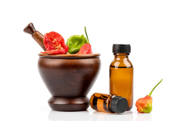 Bhut Jolokia or Ghost Pepper, Chilli fruits and extracted isolated on white background.