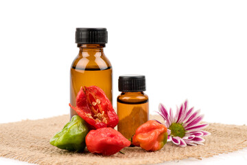 Bhut Jolokia or Ghost Pepper, Chilli fruits and extracted isolated on white background.