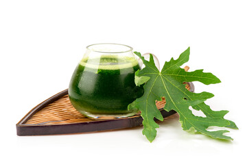 Papaya green leaf juice isolated on white bakcground.