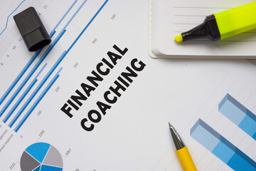 Financial concept about FINANCIAL COACHING with sign on the sheet.