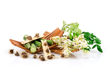 Moringa green leaves ,seeds and flowers isolated on white background.