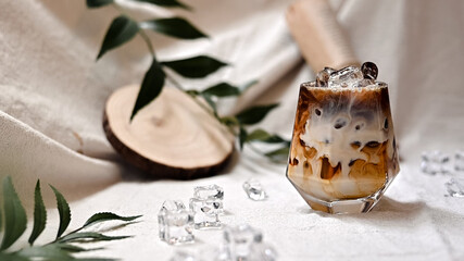 Close-up of iced coffee served on black table at cafe​