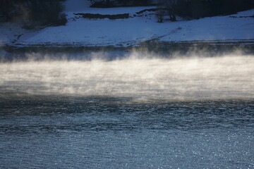 mist over the lake  in Serre Ponçon, France