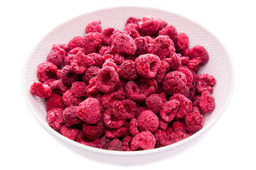 Dry raspberries in a light dish on a white background.isolated products.