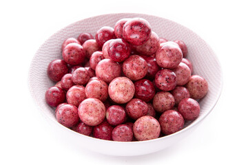 currant berries in white chocolate in a light plate on a white background.isolated products