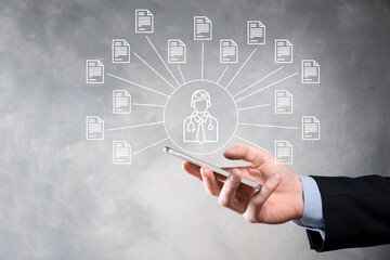 Document Management System DMS .Businessman hold doctor and document icon.Software for archiving, searching and managing corporate files and information.Internet Technology Concept.Digital security.
