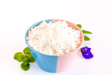 Grated white fresh coconut in bowl