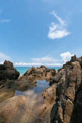 Fototapeta na wymiar rocky coast of the sea at banana beach Phuket Thailand