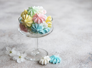 Small colorful meringues in the glass