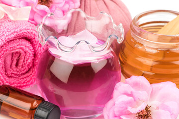 Face mask with rose water and honey for skin treatment.