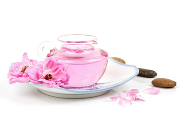 Damask rose and rose water  in spray bottle isolated on white background.