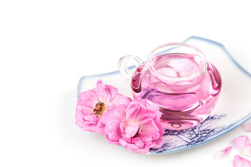 Damask rose and rose water  in spray bottle isolated on white background.