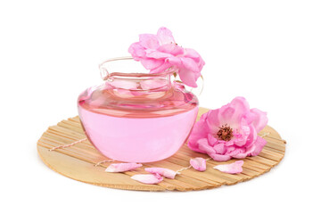 Damask rose and rose water  in spray bottle isolated on white background.