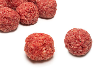 Raw meat balls isolated on white background.