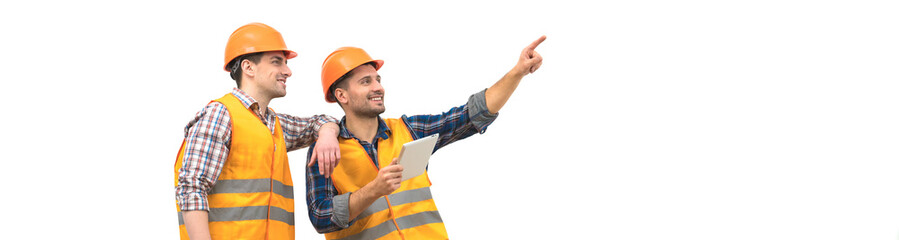 The two engineers with a tablet gesture on the white wall background