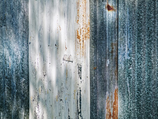 Fototapeta na wymiar Full Frame Background of Blue and White Corrugated Zinc Plates Wall