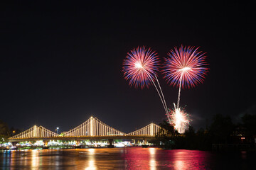 SURATTHANI, THAILAND - OCTOBER 17 : Beautiful firework display for celebration on the Tapee river on parades in Chak Phra Festival on October 17, 2015 in Suratthani, Thailand.