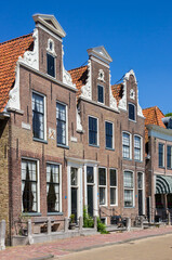 Fototapeta premium Decorated facades of historic houses at the inner harbor of Blokzijl, Netherlands