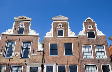 Front facades of historic houses in the harbor of Blokzijl, Netherlands