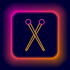 Glowing neon line Knitting needles icon isolated on black background. Label for hand made, knitting or tailor shop. Colorful outline concept. Vector