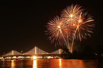 SURATTHANI, THAILAND - OCTOBER 17 : Beautiful firework display for celebration on the Tapee river on parades in Chak Phra Festival on October 17, 2015 in Suratthani, Thailand.