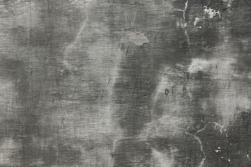 abstract gray painted old wall for background or texture, peeling paint and stucco with cracks like grunge style