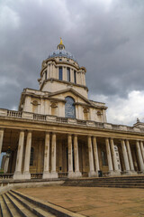 Fototapeta na wymiar Queen Mary Court Greenwich University, London with dramatic sky, looking up view